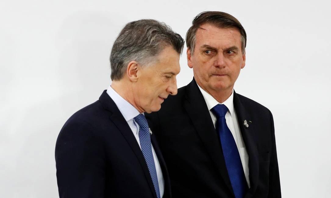 O presidente da Argentina, Mauricio Macri, ao lado de Bolsonaro, em Osaka