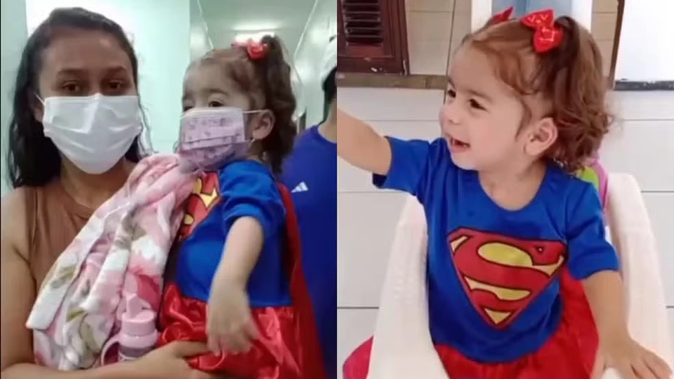 Bebê que recebeu coração de criança no Piauí recebe alta e deixa hospital vestida de heroína.