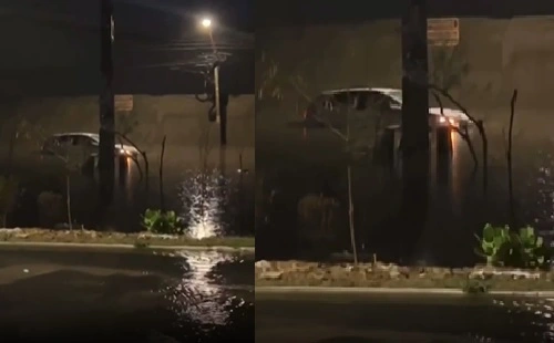 Carro fica preso em rua alagada no Promorar
